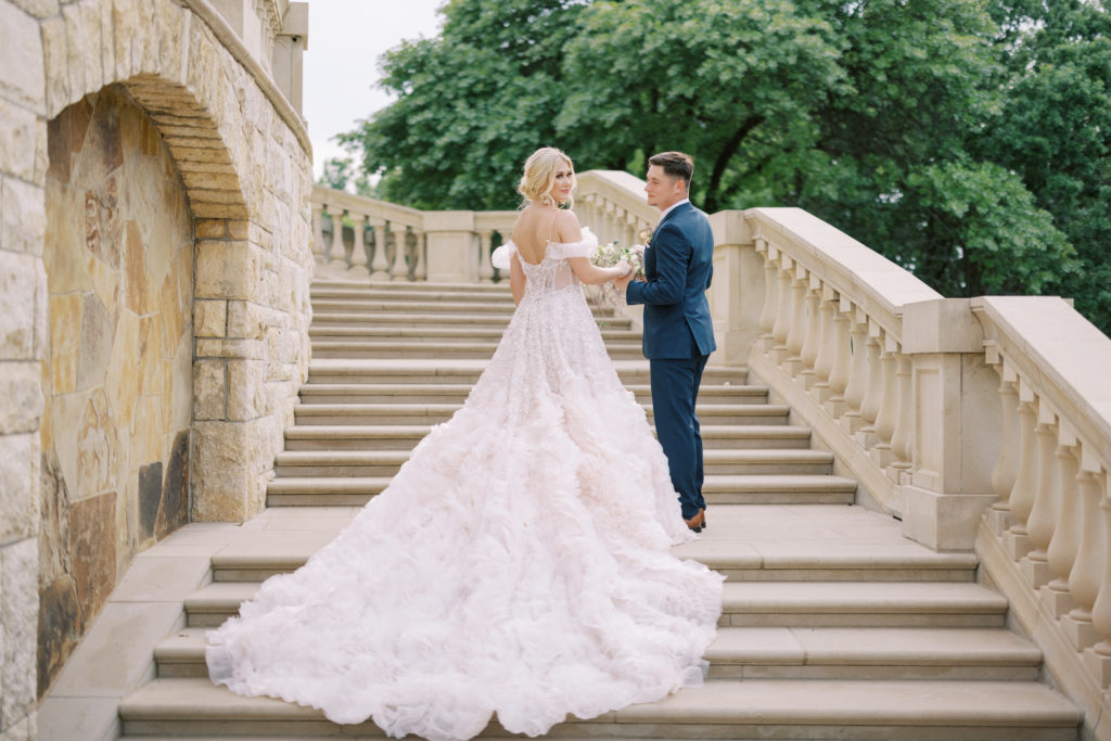 bride and groom holding hands at the fort worth wedding venue