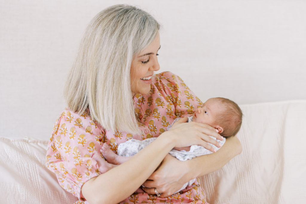 mom holding her newborn during the session 