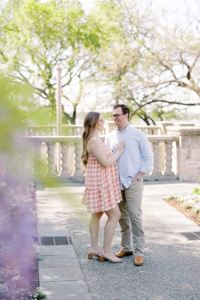 couple surrounded by trees at their dallas arboretum session