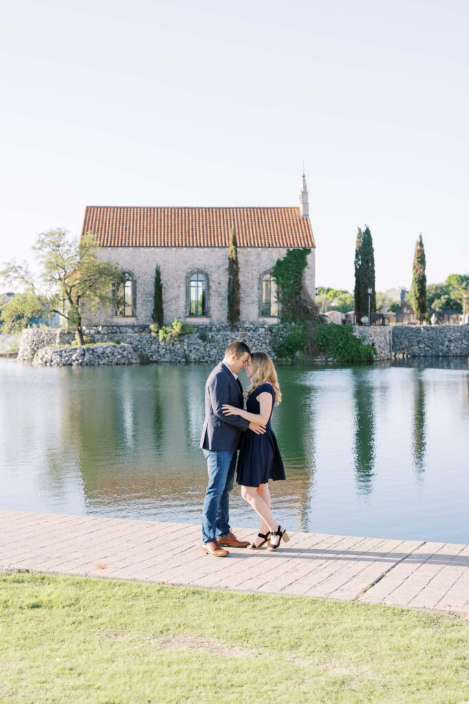 Emily&Michael holding each other at their Adriatica Village Engagement session