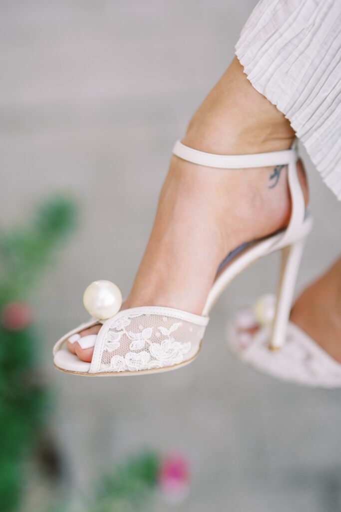 donna's shoes at the engagement session at the adriatica village
