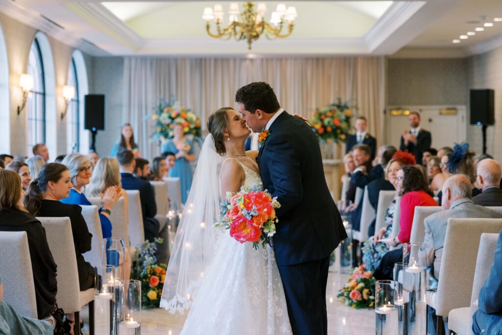 bride and groom kissing at their wedding at the rosewodd mansion