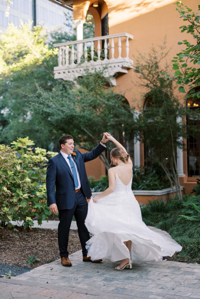 bride and groom portraits twirling at the rosewood lansion 