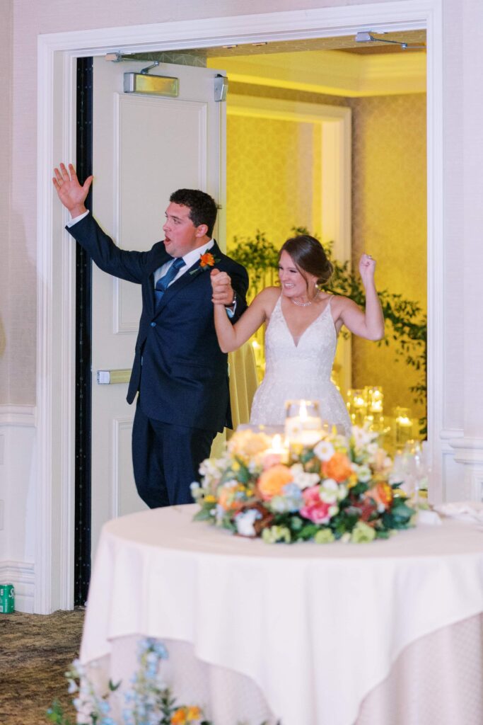 bride and groom's grand entrance at the rosewood mansion