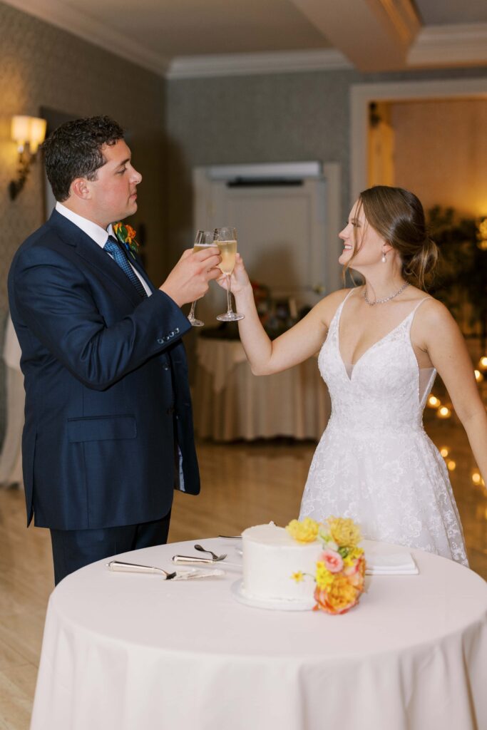 bride and groom toasting at the rosewood mansion 
