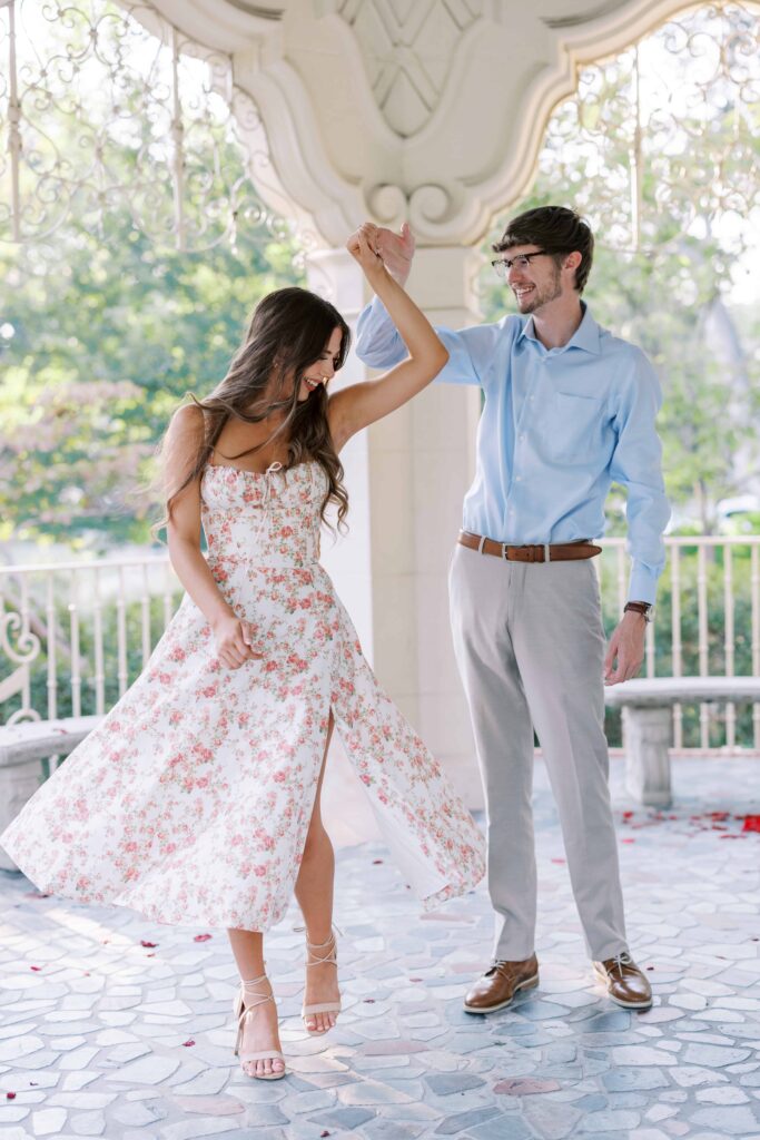 couple twirling in the gazebo for their flippen park engagement photos