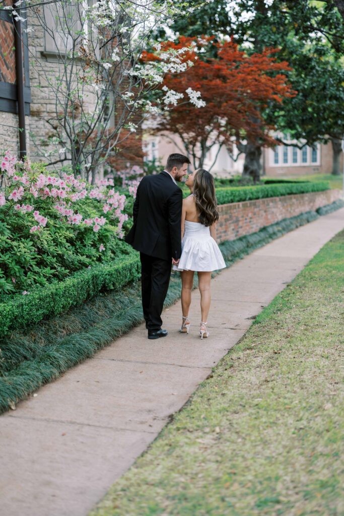 couple walking away kissing during their engagement session