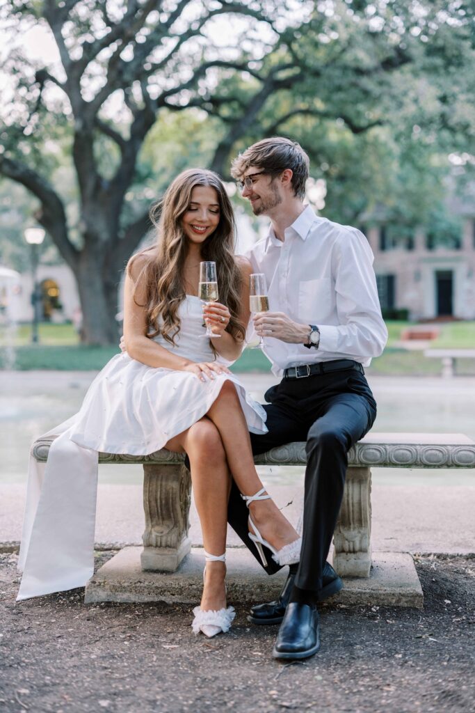 couple toasting during their engagement session 