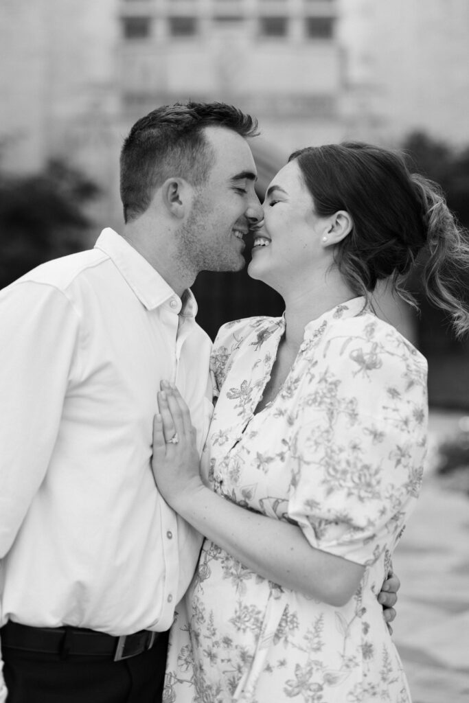 sam and spencer going nose to nose at their Engagement Session at HPUMC in Dallas