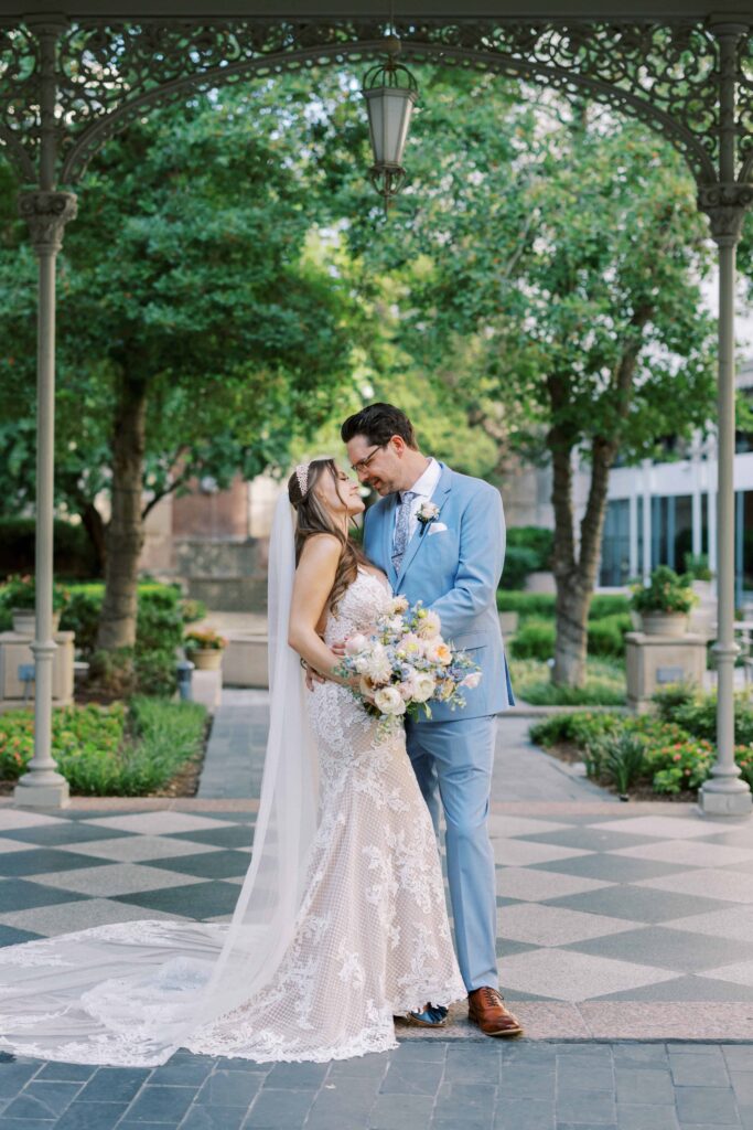 bride and groom looking at each other during their Hotel Crescent Court wedding