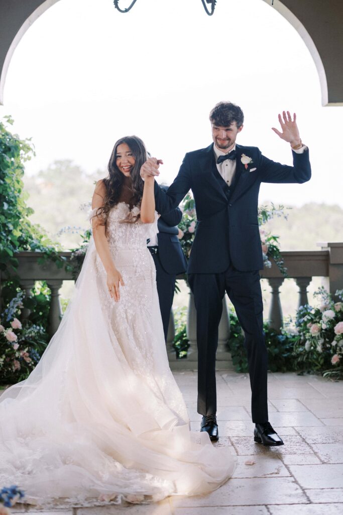 bride and groom just married walking up the aisle at their Intimate Wedding at Villa Antonia near Austin