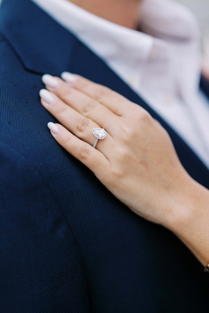 bride showing off her ring during her Paris engagement session