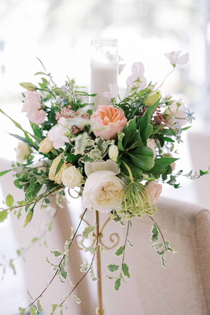 pastel florals with a candlestick at this Hotel Crescent Court wedding