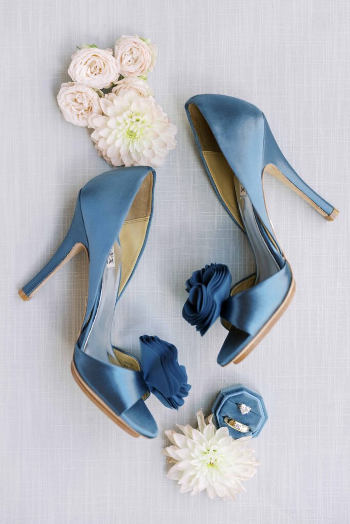 shoe flatlay with rings and flowers at a Hotel Crescent Court wedding