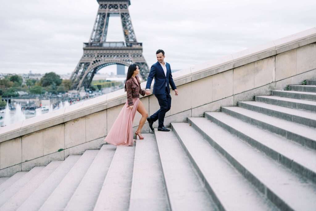 Paris engagement session with Laura in a pink dress and James in a blue suit