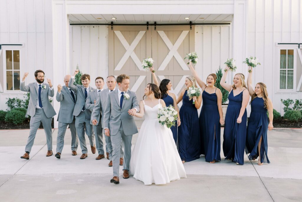 bridal party walking in front of The Nest at Ruth Farms