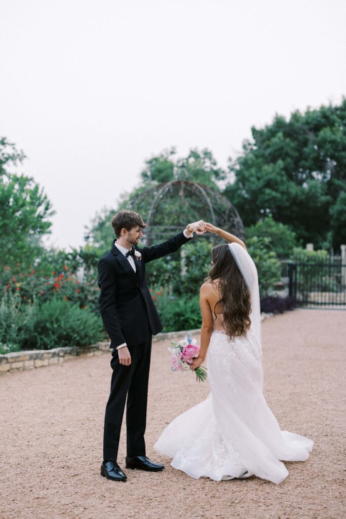 bride and groom dancing in the garden during their Intimate Wedding at Villa Antonia near Austin