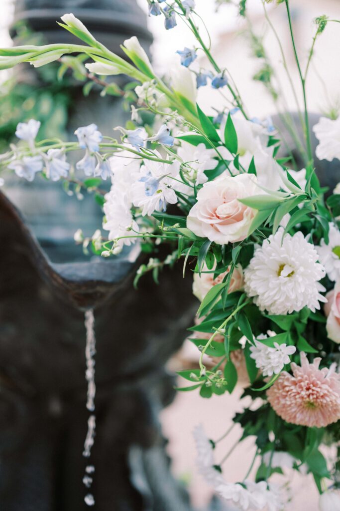 florals in the fountain at this Intimate Wedding at Villa Antonia near Austin