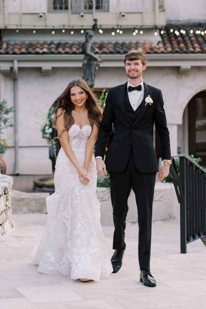 bride and groom doing their grand entrance to their reception at their Intimate Wedding at Villa Antonia near Austin