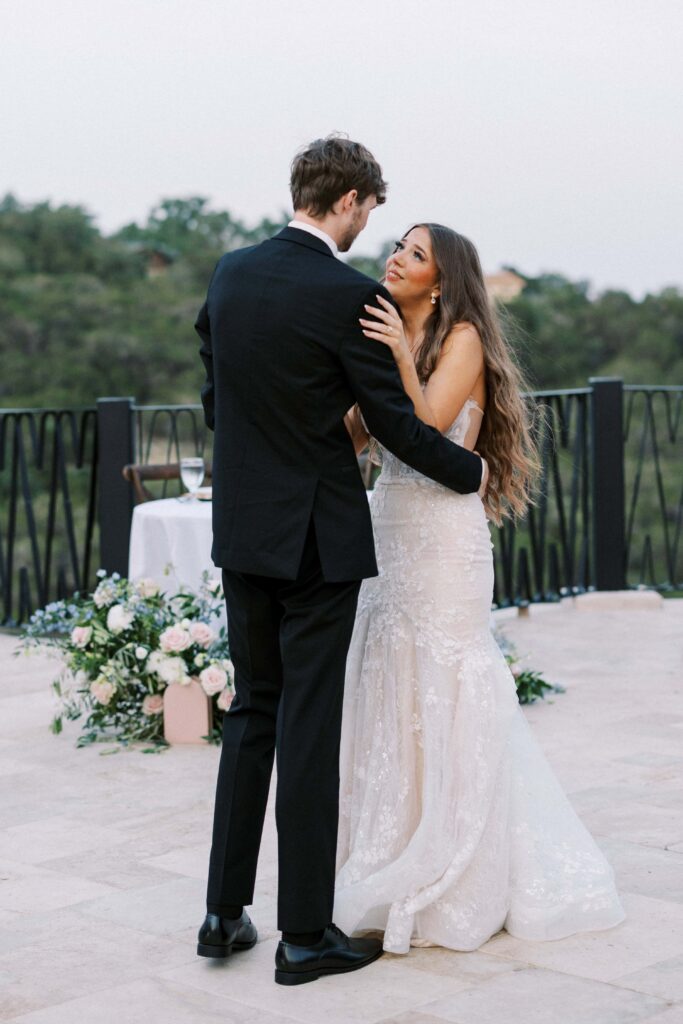 bride and groom dancing on the patio at their Intimate Wedding at Villa Antonia near Austin