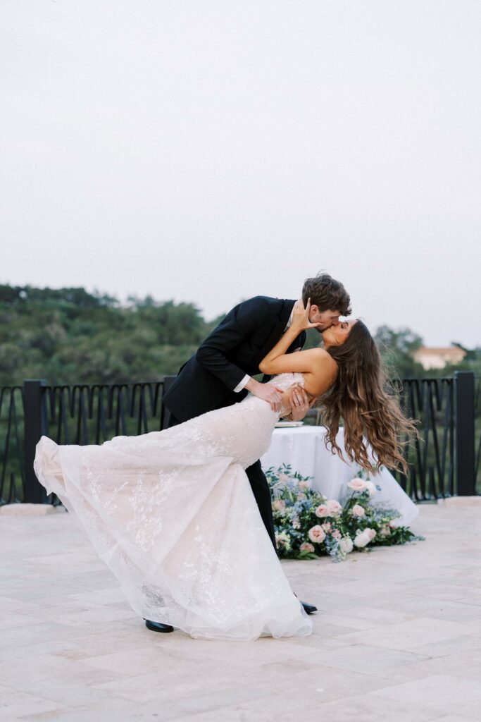 groom dipping the bride during their first dance at their Intimate Wedding at Villa Antonia near Austin