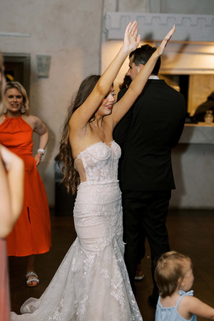 bride dancing in her wedding dress at her Intimate Wedding at Villa Antonia near Austin