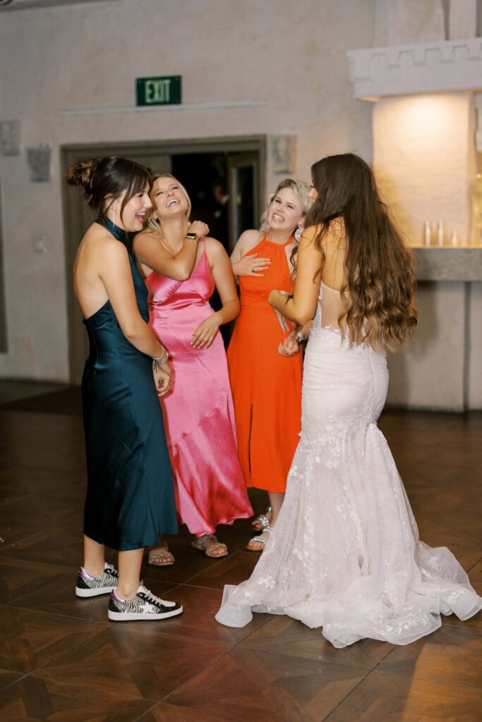 bride dancing with her girlfriends during their Intimate Wedding at Villa Antonia near Austin