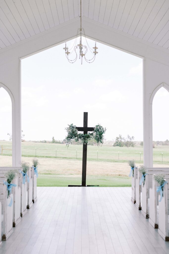 cross adorned with baby's breath for a Wedding at Chandelier Farms