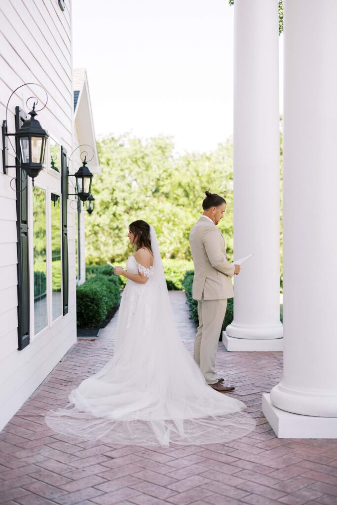 bride and groom facing away from each other reciting their private vows in the front of The Springs Event Venue Weatherford