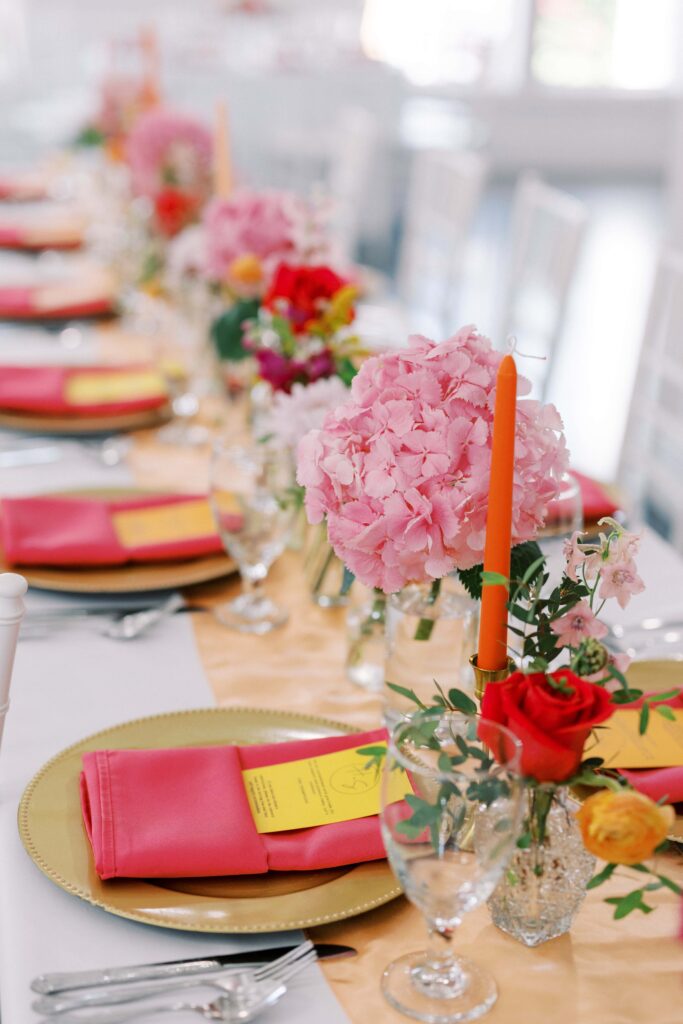 orange, pink, yellow and red tablescape at The Springs Event Venue Weatherford