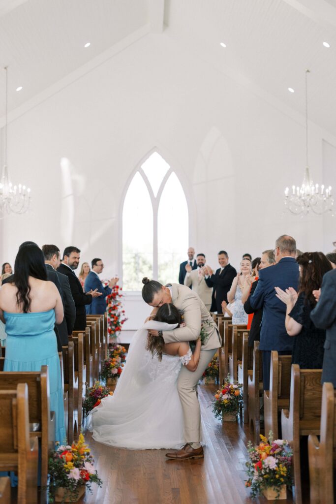 bride and groom coming up the altar at the chapel of The Springs Event Venue Weatherford