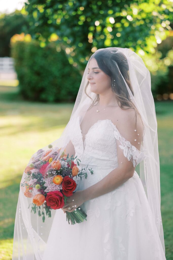 bride holding her bouquet covered under her veil at The Springs Event Venue Weatherford