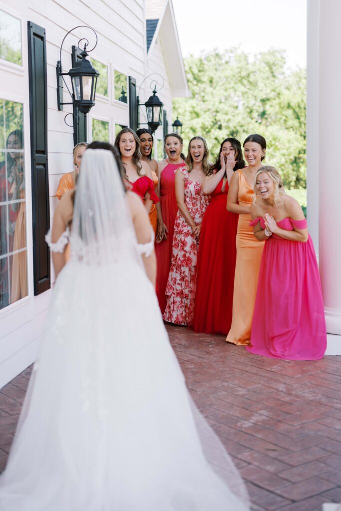 bridesmaids being overwhelmed after a bridesmaids first look at The Springs Event Venue Weatherford 