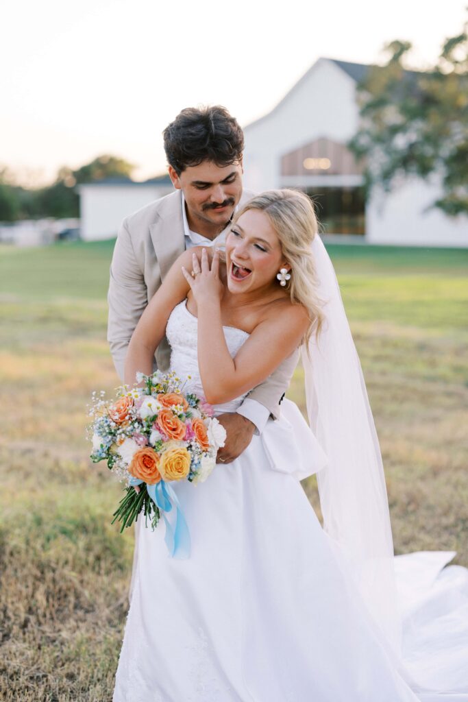 groom tickling the bride during their Wedding at Chandelier Farms