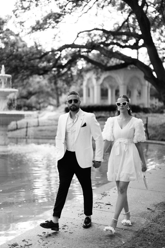 bride and groom walking by the pond during their Engagement Session at Flippen Park