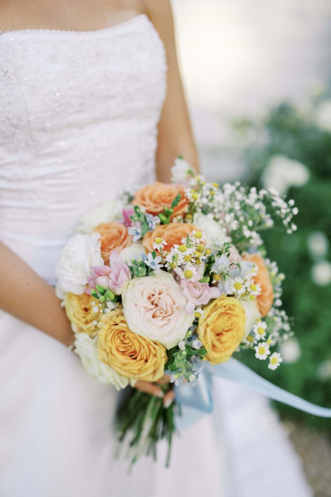 bouquet with orange, yellow, pink, white and blue flowers for a Wedding at Chandelier Farms