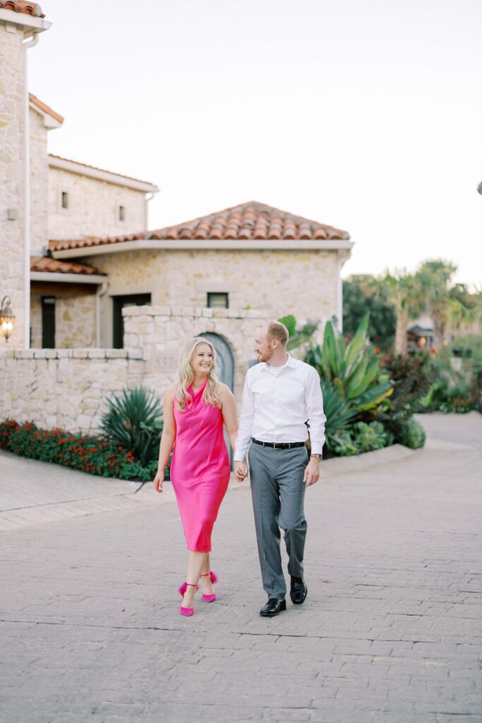 Bride and groom walking hand in hand for their Adriatica Village Engagement