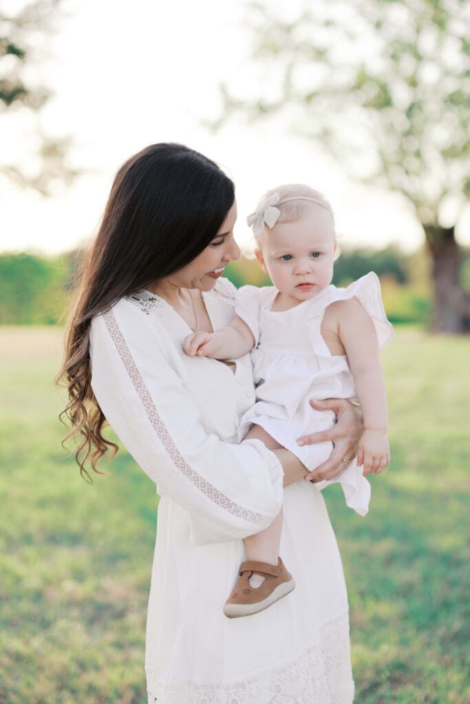 Jessica holding her baby at her Sansom Park family session