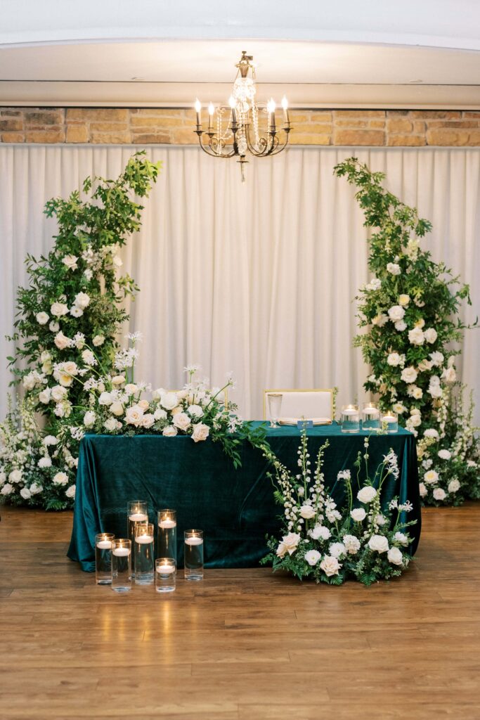 sweetheart table with all white florals at this aristide mansfield wedding 