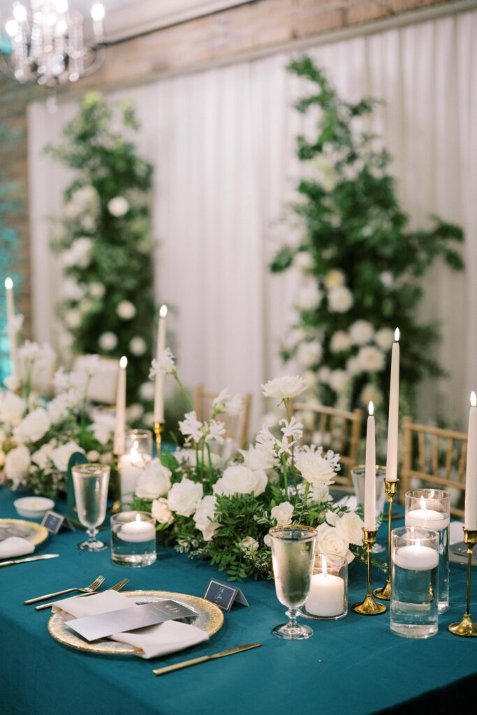 tablescape shot with gold and emerald colors for this aristide mansfield wedding