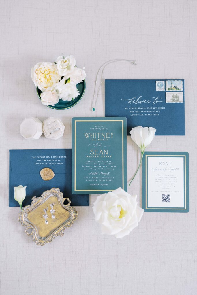 flatlay of the invitation suites for this aristide mansfield wedding