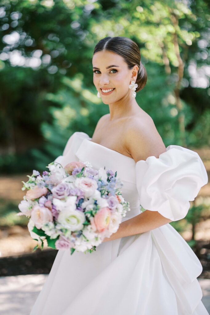 bride smiling at the camera at her brighton abbey wedding