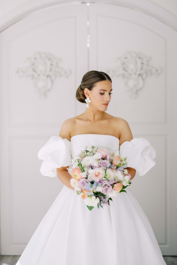 bride inside the chapel looking at her shoulder at her brighton abbey wedding