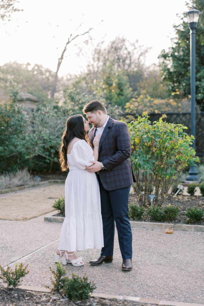 Caleb and Tori looking at each other during their Fort Worth Botanic Garden Engagement