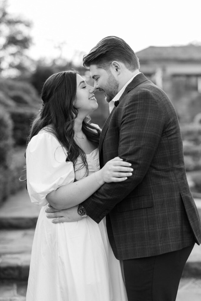 Caleb and tori rubbing noses at their Fort Worth Botanic Garden Engagement