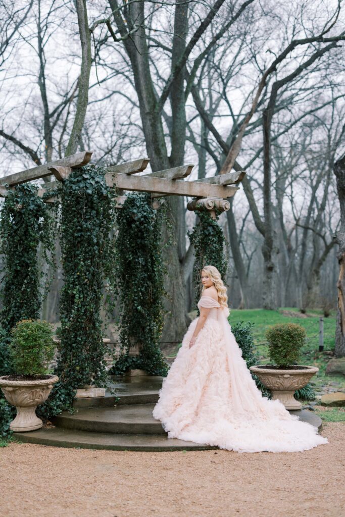 bride walking up the altar's stairs at The Springs Event Venue Waxahachie
