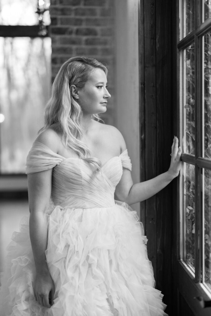 bride looking at the window at The Springs Event Venue Waxahachie