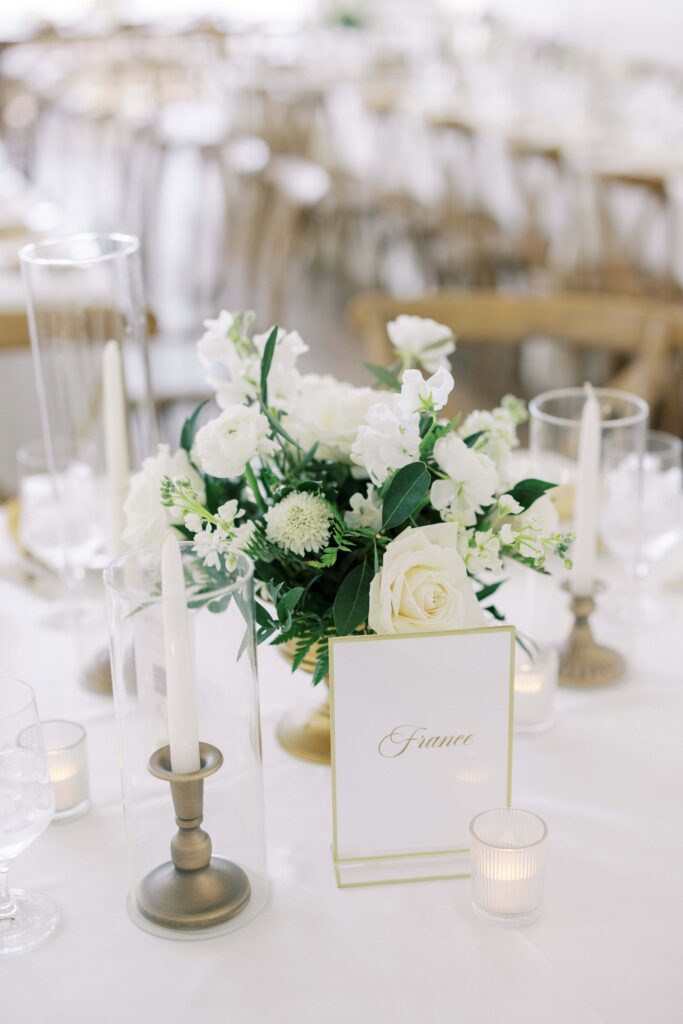 tablescape with gold candlesticks and white flower centerpiece at tgis Lakeview Hills Wedding