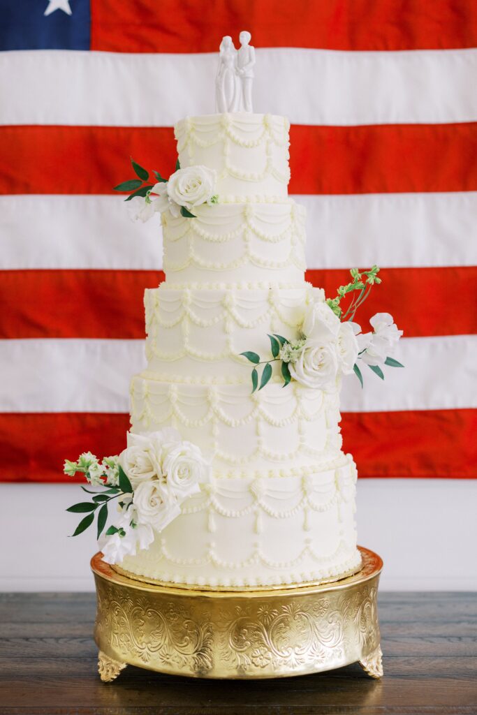 white wedding cake with 5 tiers at this Lakeview Hills Wedding