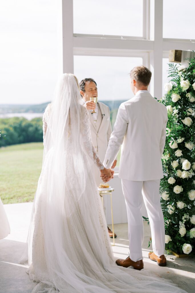bride and groom taking communion during their Lakeview Hills Wedding